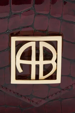 Elly Logo Embossed Mini Clutch Bag in Burgundy