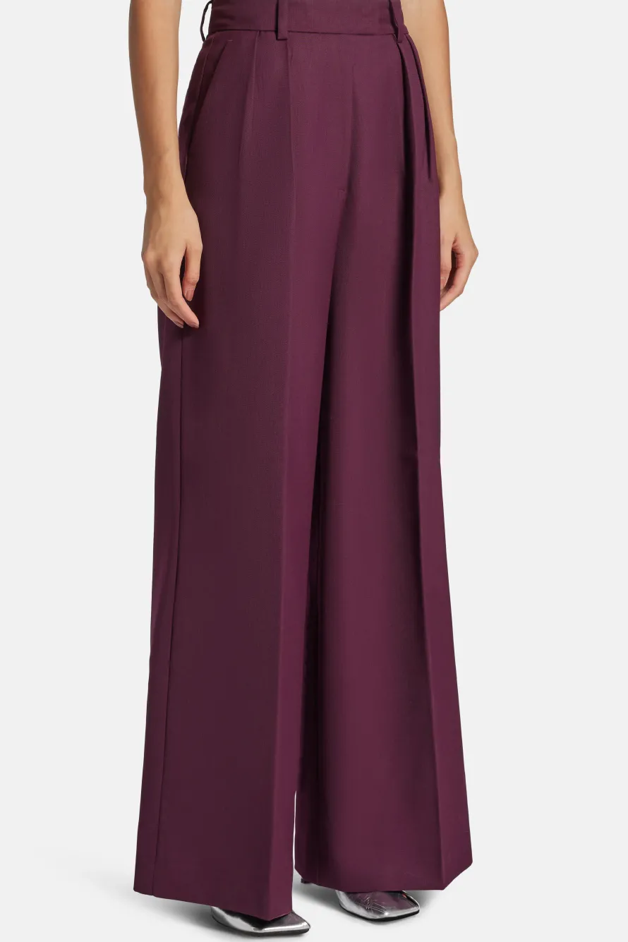 Lou High Waisted Flared Wool Trousers in Burgundy