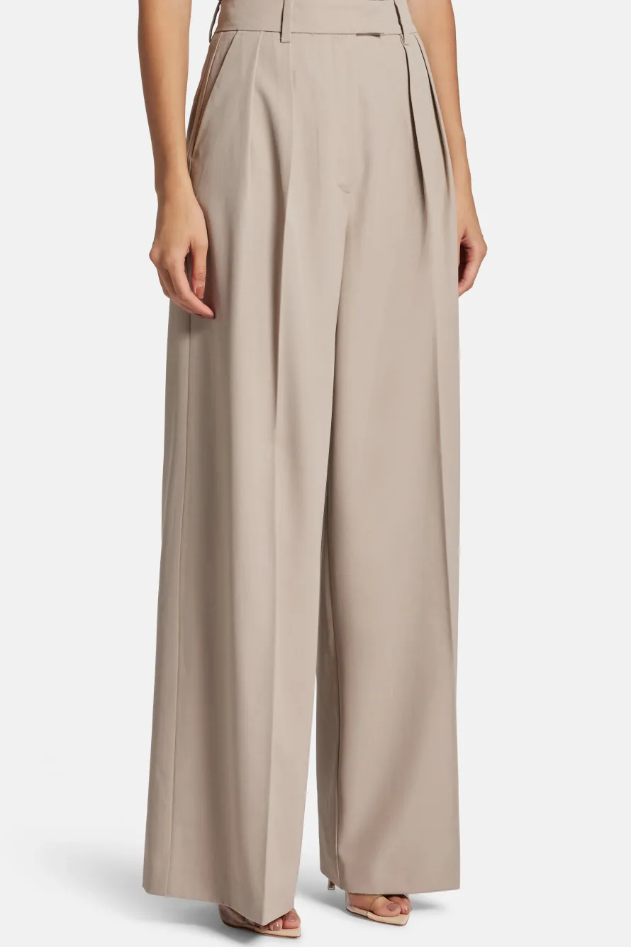 Lou High Waisted Flared Wool Trousers in Beige