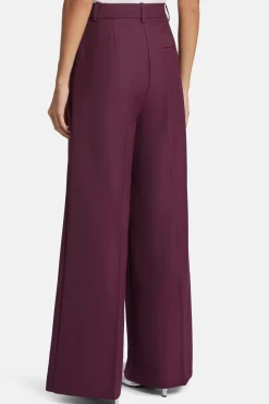 Lou High Waisted Flared Wool Trousers in Burgundy