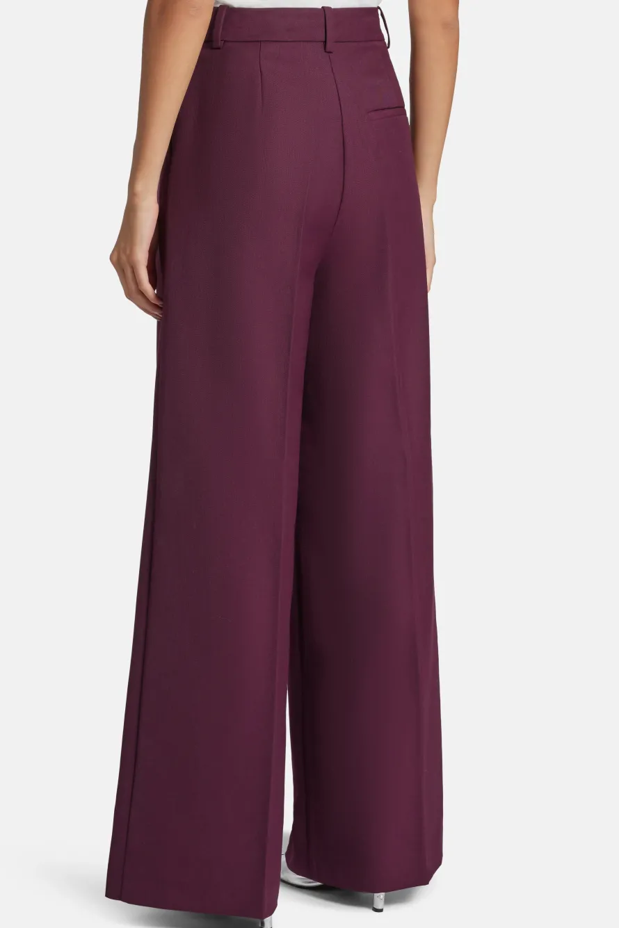 Lou High Waisted Flared Wool Trousers in Burgundy