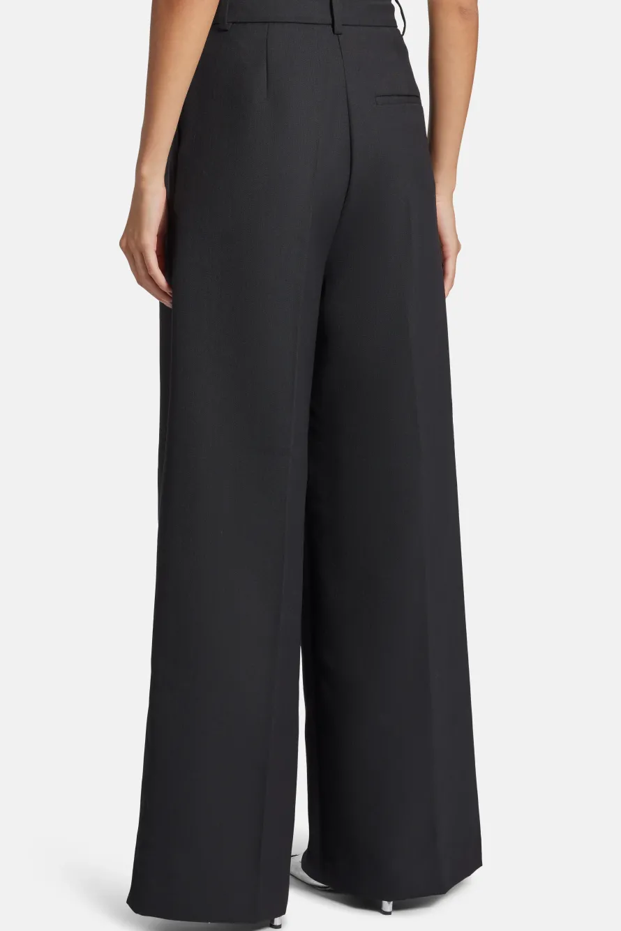 Lou High Waisted Flared Wool Trousers in Black