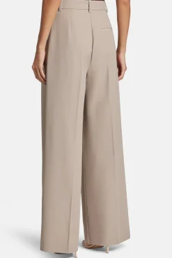 Lou High Waisted Flared Wool Trousers in Beige