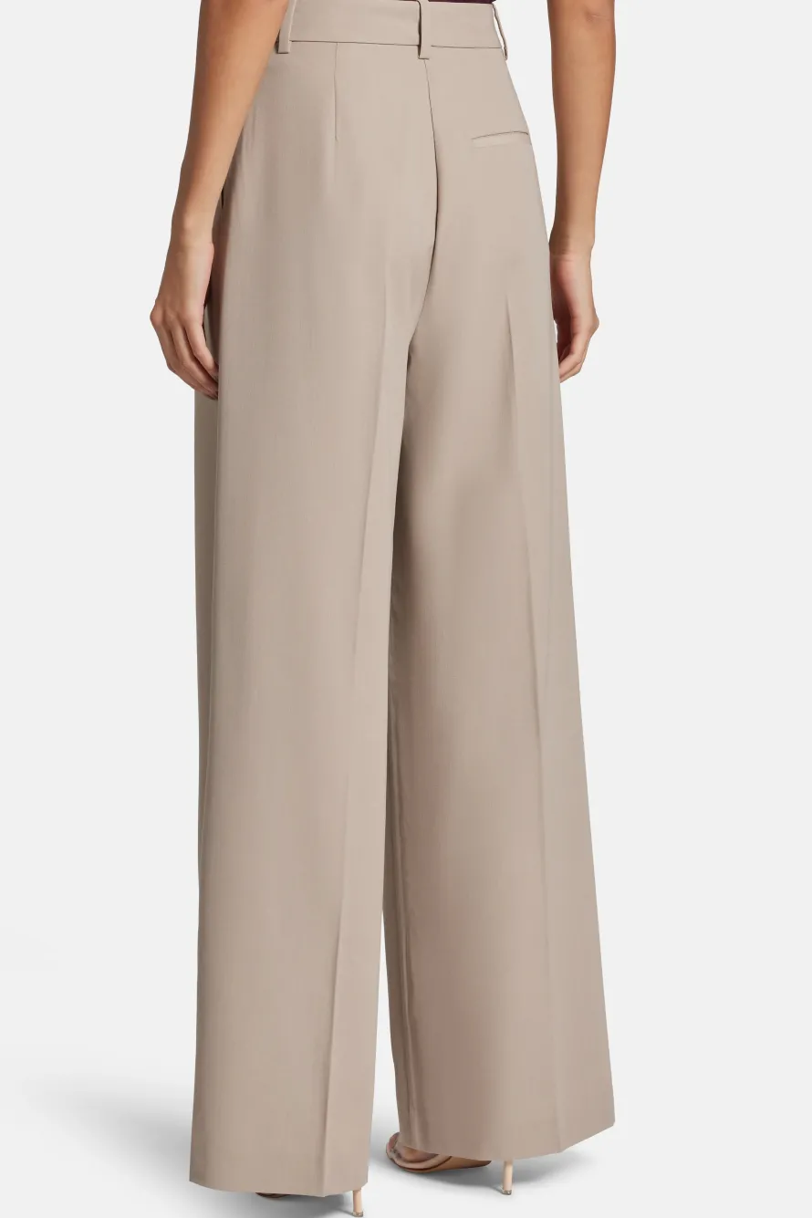 Lou High Waisted Flared Wool Trousers in Beige